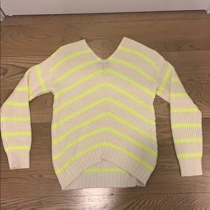 white and neon yellow sweater